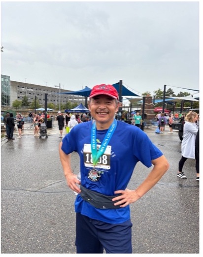 Jiming standing after his race