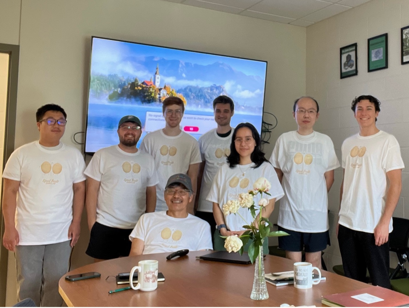 Lab members wearing white T-shirts that say spud buds